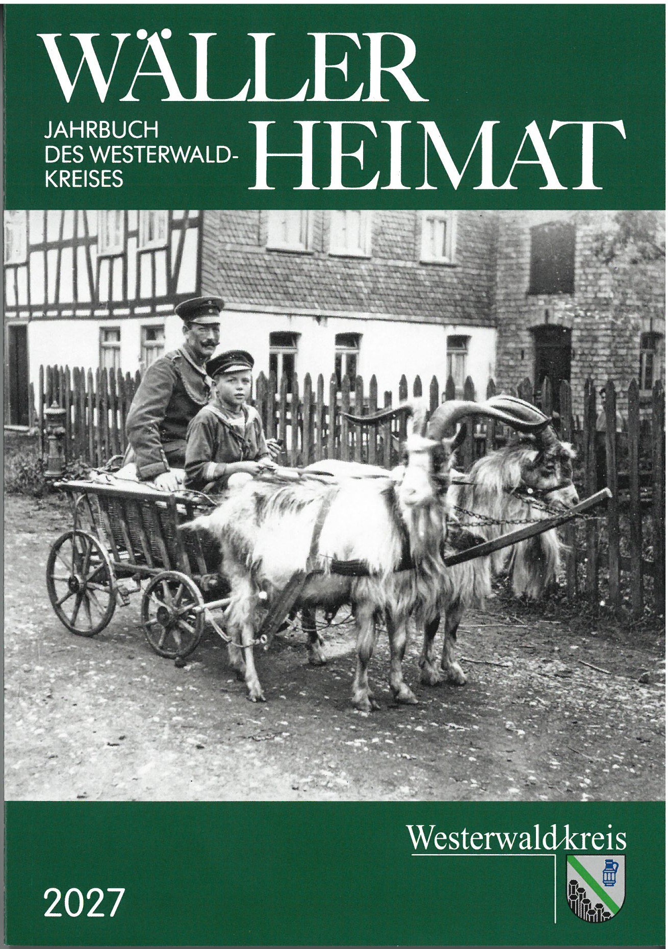 Titelseite Wäller Heimat 2027 mit Schwarz-Weiß-Foto von Mann mit Kind auf Ziegen-Leiterwagen